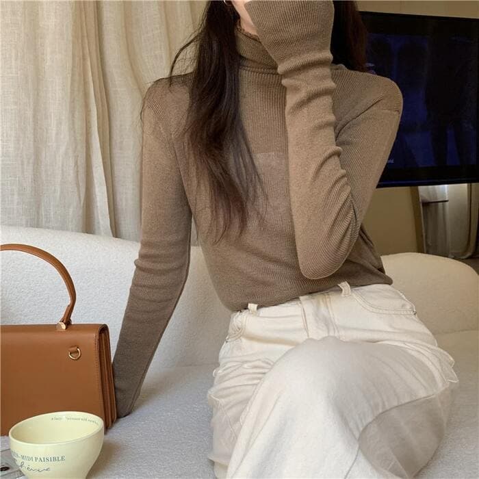 骨格ウェーブフィットリブネックニット